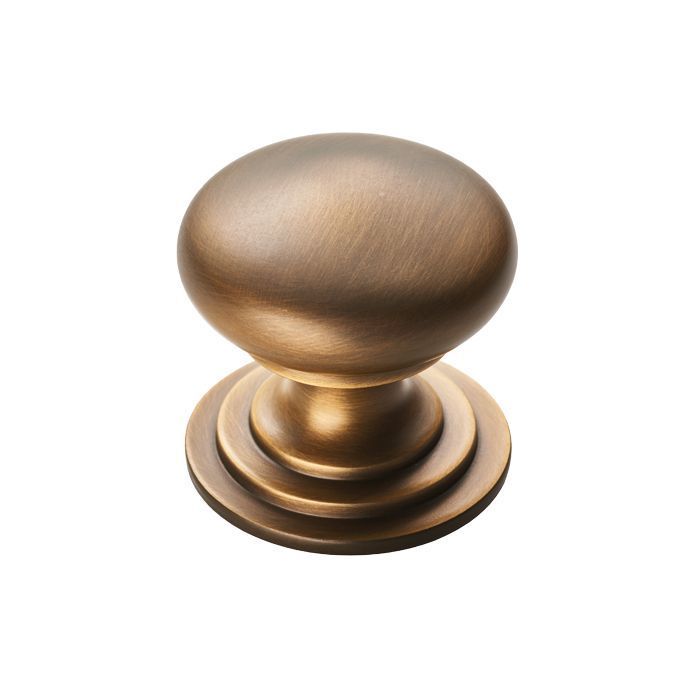 An antique brass mushroom cabinet knob for kitchen cupboards.