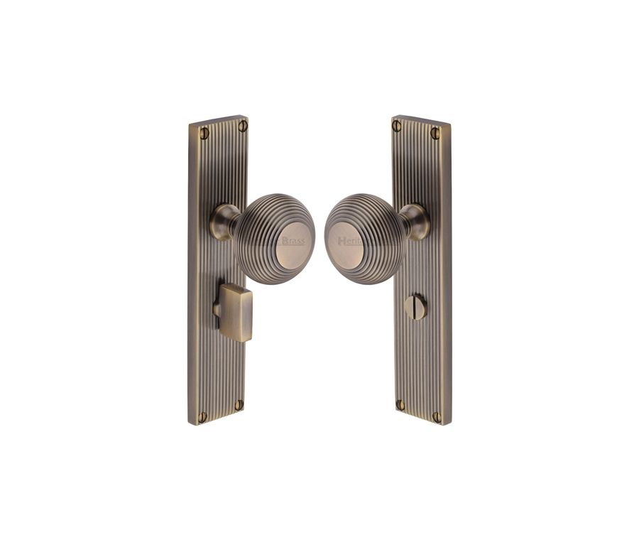 Heritage Brass Antique Brass Beehive Door Knob on Reeded Plate - Bathroom Set