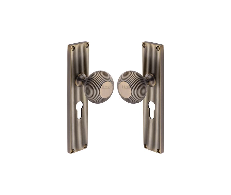 Heritage Brass Antique Brass Beehive Door Knob on Reeded Plate - Euro Profile Set