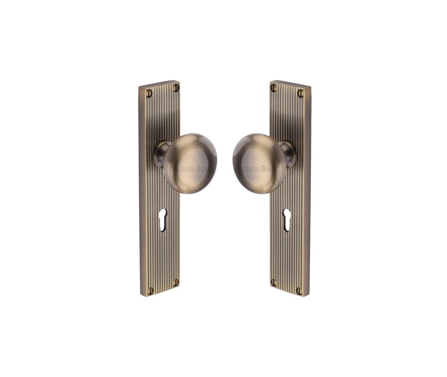 Heritage Brass Antique Brass Victoria Door Knob on Reeded Plate - Lock Set
