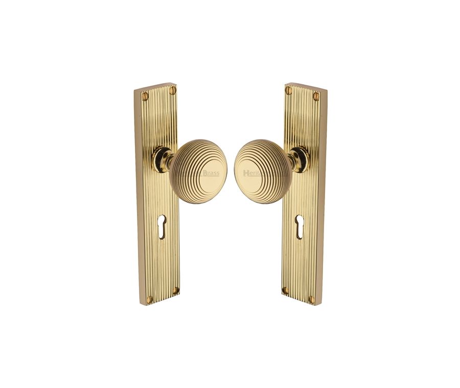 Heritage Brass Polished Brass Beehive Door Knob on Reeded Plate - Lock Set