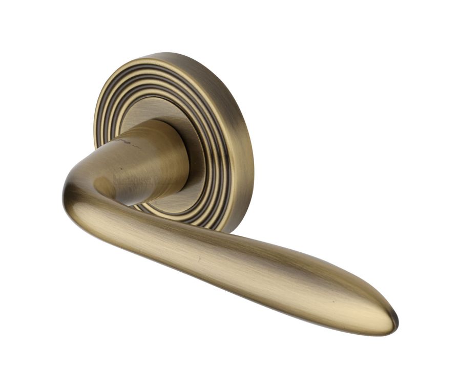 Antique Brass Sutton Reeded Door Handle on Round Rose