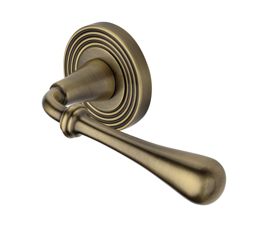 Antique Brass Roma Reeded Door Handle on Round Rose