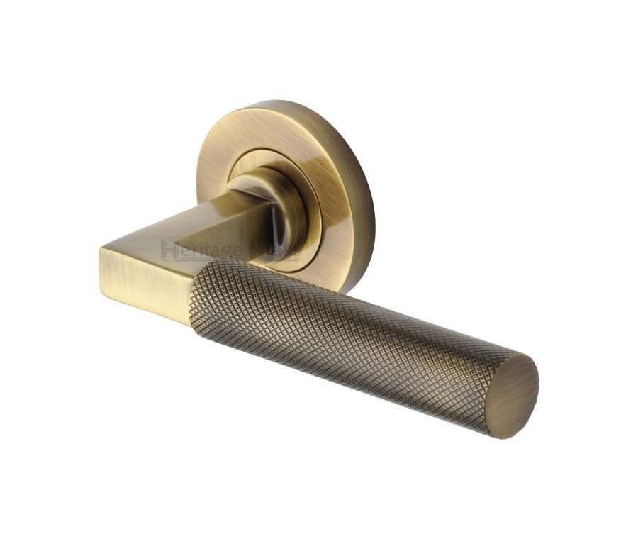 Antique Brass Signac Door Handle on Round Rose
