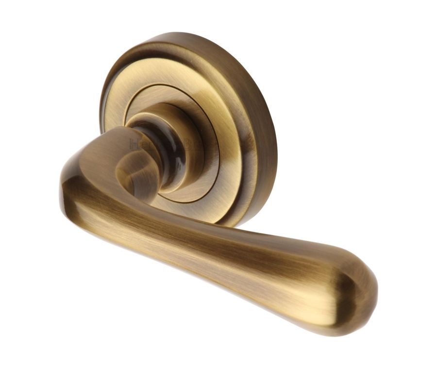 Antique Brass Charlbury Door Handle on Round Rose