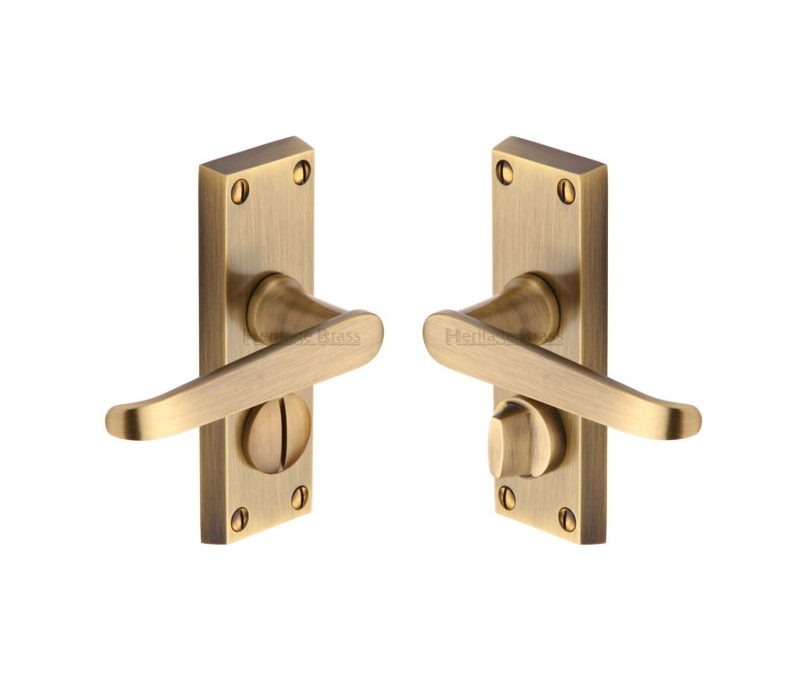 Heritage Brass Antique Brass Victoria Short Door Handle on Plate - Bathroom Set