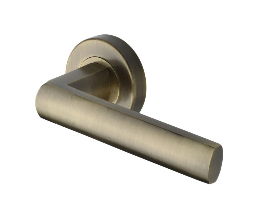 Antique Brass Poseidon Door Handle on Round Rose