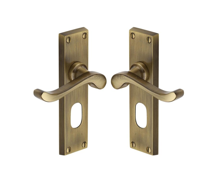 Heritage Brass Antique Brass Bedford Door Handle on Plate - Oval Profile