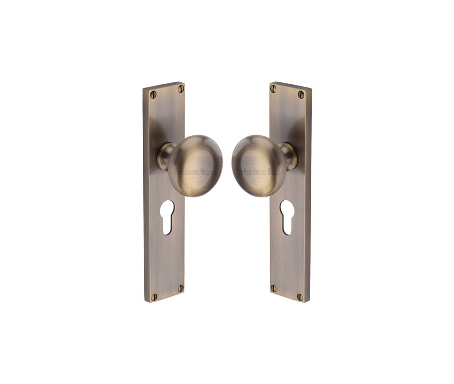 Heritage Brass Antique Brass Victoria Door Knob on Plate - Euro Lock Set