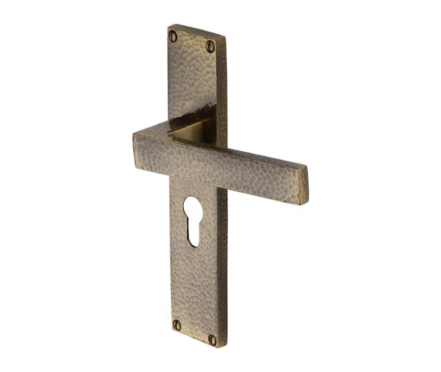 Heritage Brass Antique Brass Delta Hammered Door Handle on Plate - Euro Profile