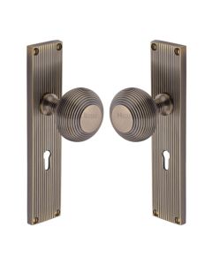 Heritage Brass Antique Brass Beehive Door Knob on Reeded Plate - Lock Set
