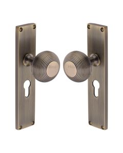 Heritage Brass Antique Brass Beehive Door Knob on Reeded Plate - Euro Profile Set