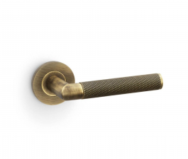 Alexander & Wilks Antique Brass Harrier Knurled Lever on rose | AW210AB