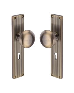 Heritage Brass Antique Brass Victoria Door Knob on Reeded Plate - Lock Set