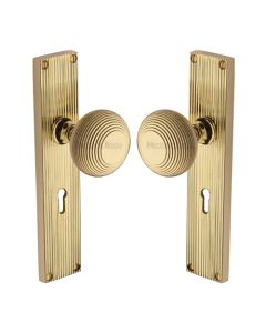Heritage Brass Polished Brass Beehive Door Knob on Reeded Plate - Lock Set