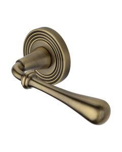 Antique Brass Roma Reeded Door Handle on Round Rose