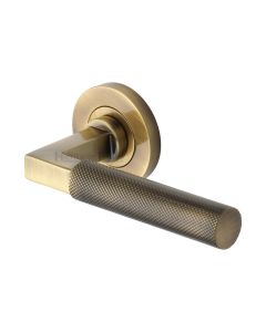 Antique Brass Signac Door Handle on Round Rose