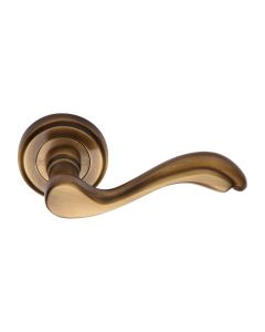 Antique Brass Lisboa Door Handle on Round Rose