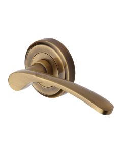 Antique Brass Sophia Door Handle on Round Rose