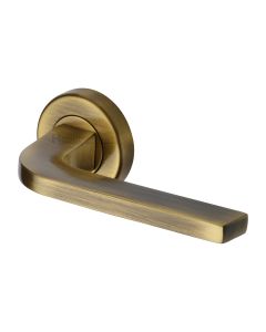Antique Brass Bellagio Door Handle on Round Rose