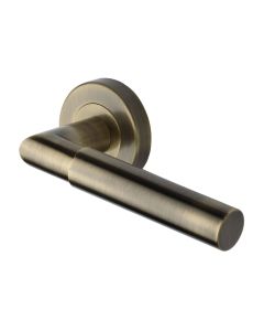 Antique Brass Bauhaus Mitre Door Handle on Round Rose
