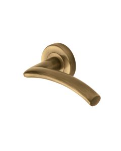 Antique Brass Centaur Door Handle on Round Rose