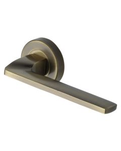 Antique Brass Metro Angled Door Handle on Round Rose