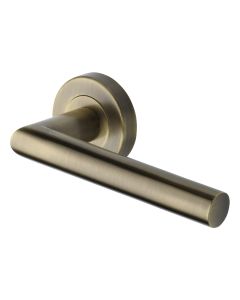 Antique Brass Athena Door Handle on Round Rose