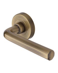 Antique Brass Octave Door Handle on Round Rose