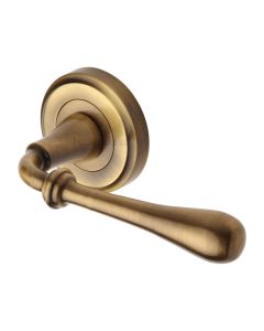 Antique Brass Roma Door Handle on Round Rose