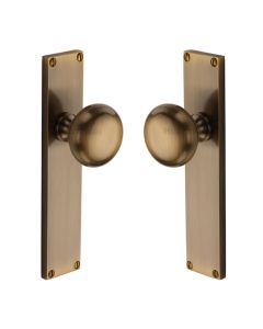 Heritage Brass Antique Brass Victoria Door Knob on Plate - Latch Set
