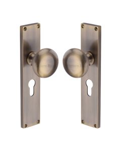 Heritage Brass Antique Brass Victoria Door Knob on Plate - Euro Lock Set