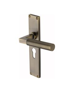 Heritage Brass Antique Brass Bauhaus Knurled Door Handle on Plate - Euro Profile
