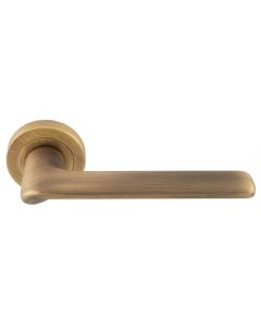 Set Manital Antique Brass Vortex Lever Furniture on round rose | VX5AB